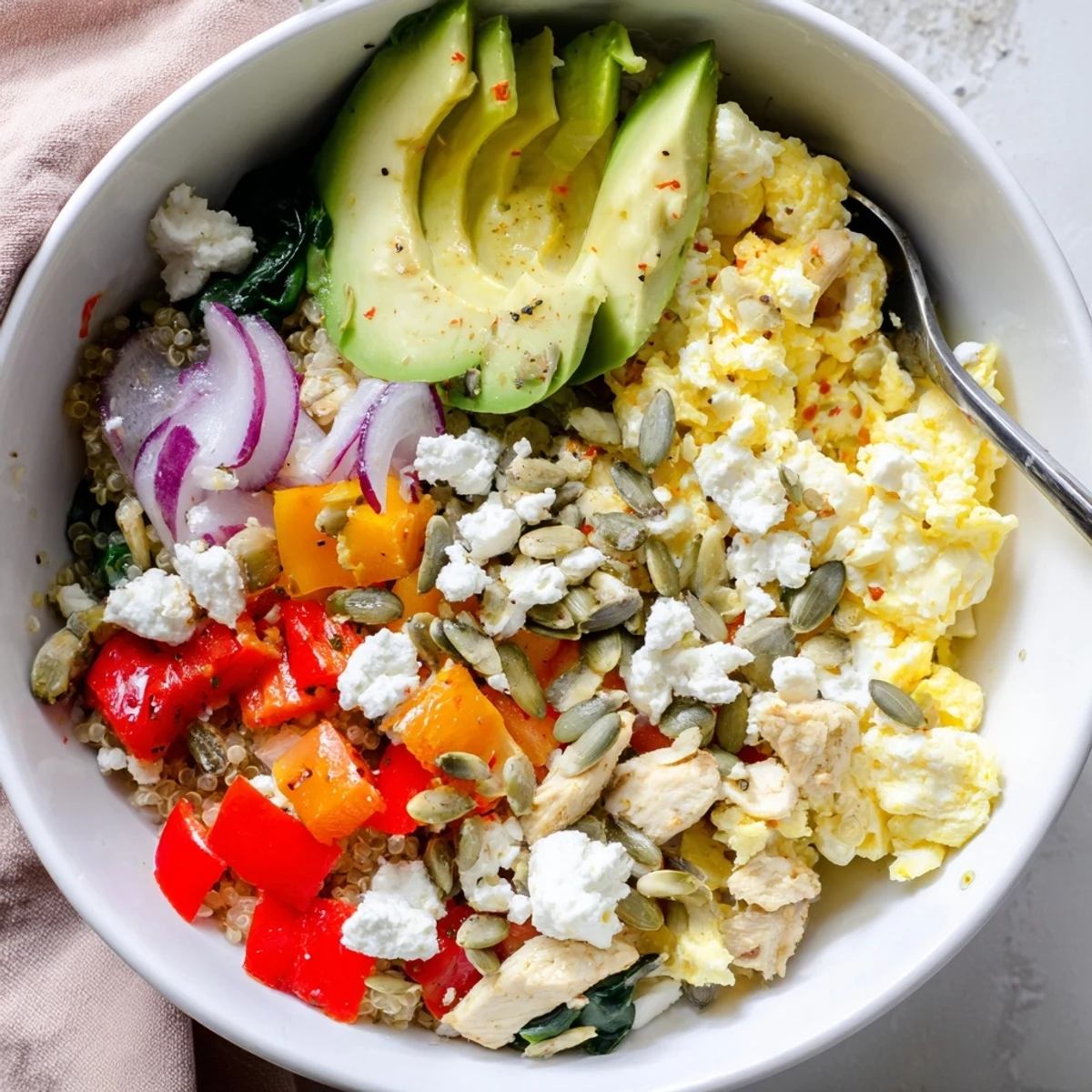 Hearty Easy High Protein Breakfast Bowl featuring cottage cheese eggs, quinoa, cherry tomatoes, and crisp toppings