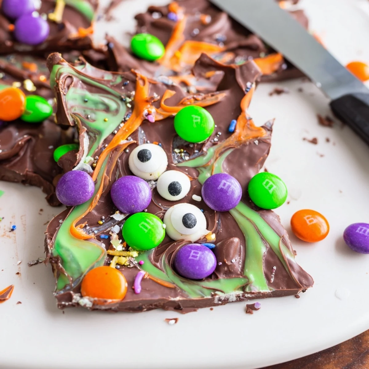 Melting Witches Bark with swirled chocolates, candy eyes, and colorful Halloween sprinkles