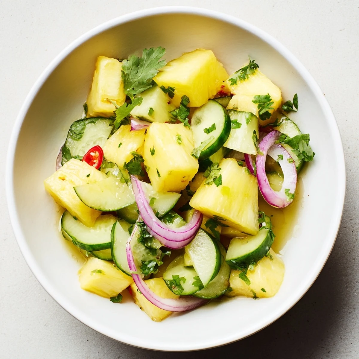 Serve Pineapple Cucumber Salad with grilled fish or tacos for refreshing side