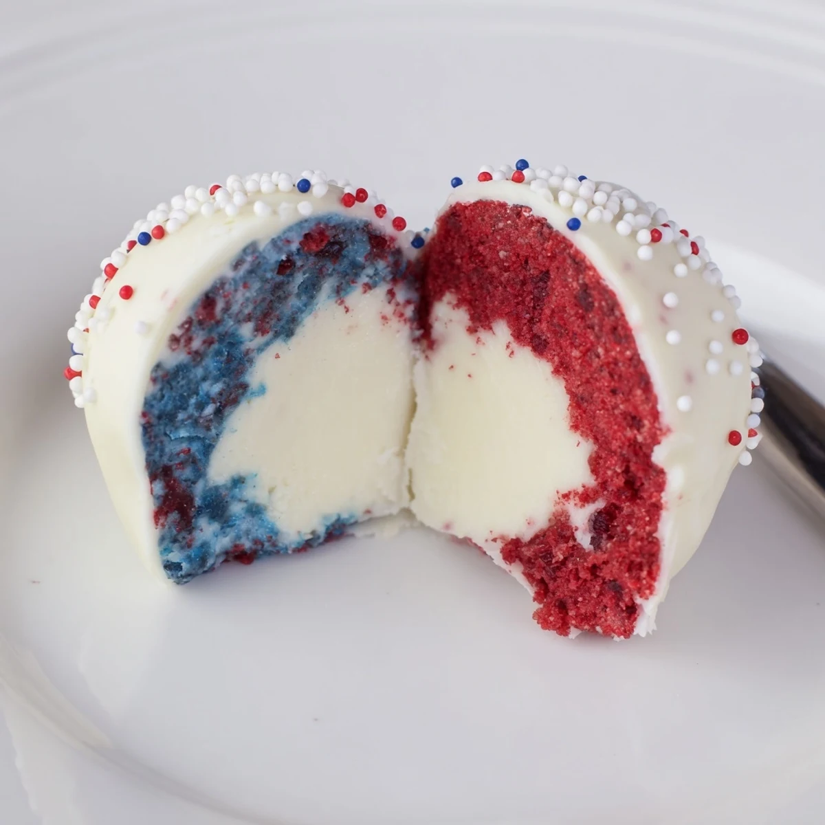 Hand-rolled Fourth of July truffles with raspberry-blueberry swirls, perfect chilled bites