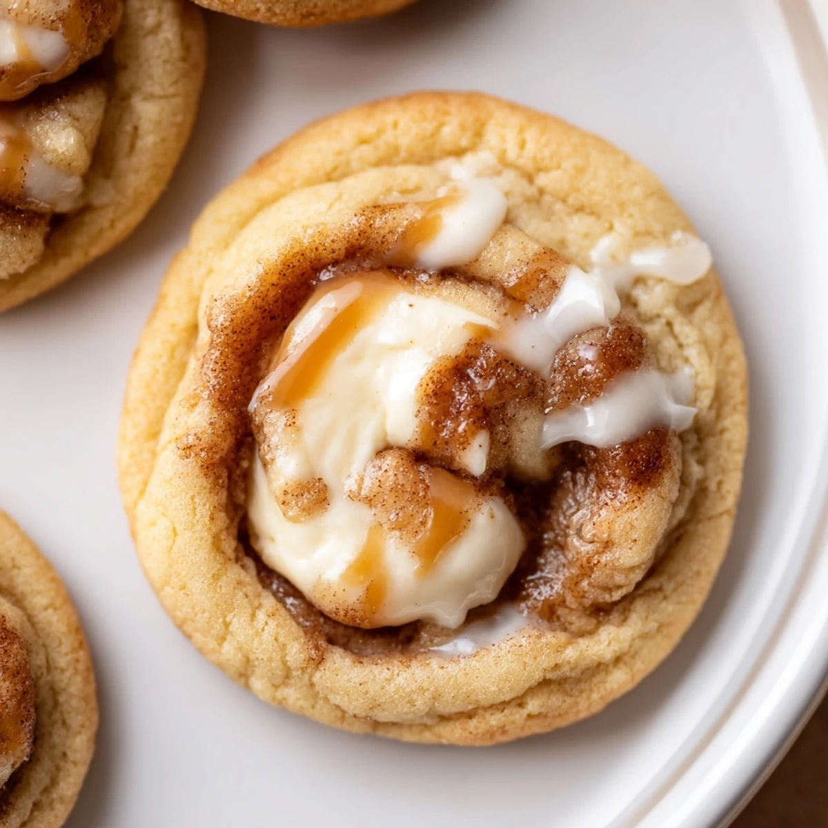 Cinnamon Roll Cheesecake Cookies warm from oven, gooey centers and cinnamon swirl