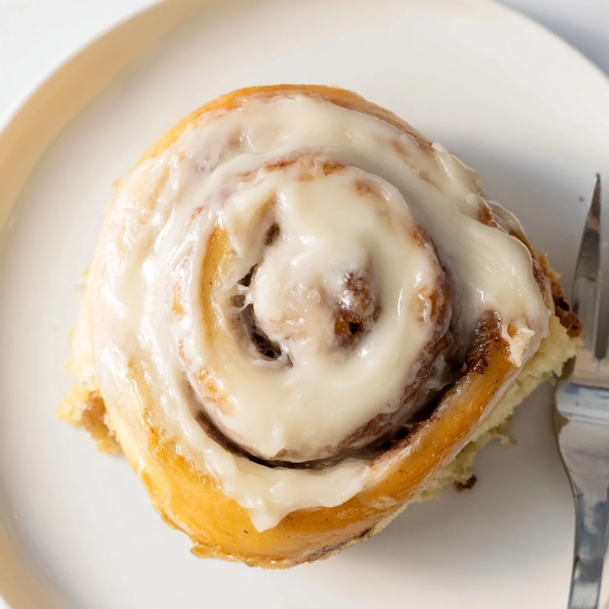 Golden-brown Banana Bread Cinnamon Rolls arranged in baking dish, perfect for brunch