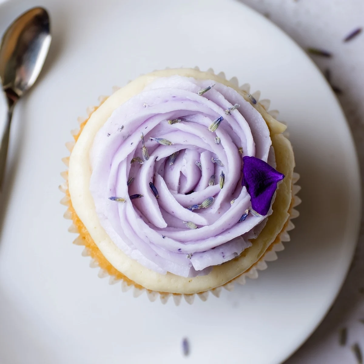 Light airy Lavender Buttercream Floral Frosting spread smooth on lemon cake
