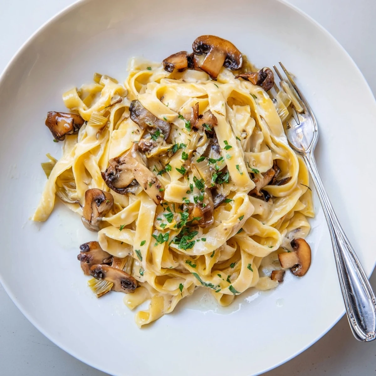 Creamy Caramelized Leek Mushroom Gruyere Pasta, silky noodles, nutty cheese aroma