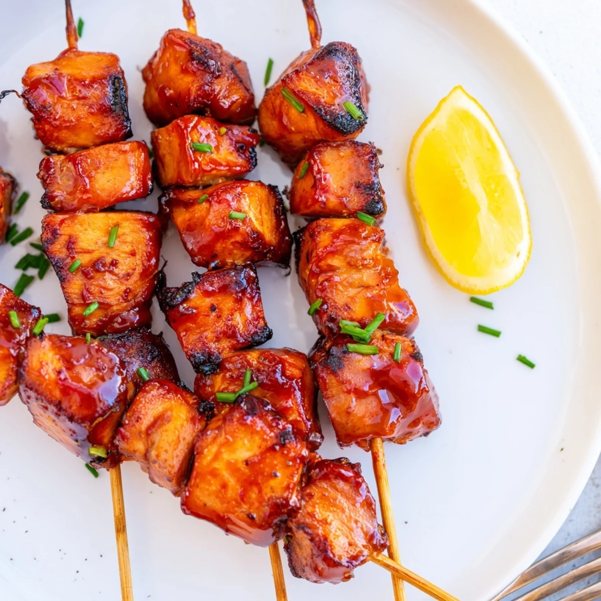 Grilled Juicy Honey Garlic BBQ Chicken Skewers, smoky edges and parsley garnish