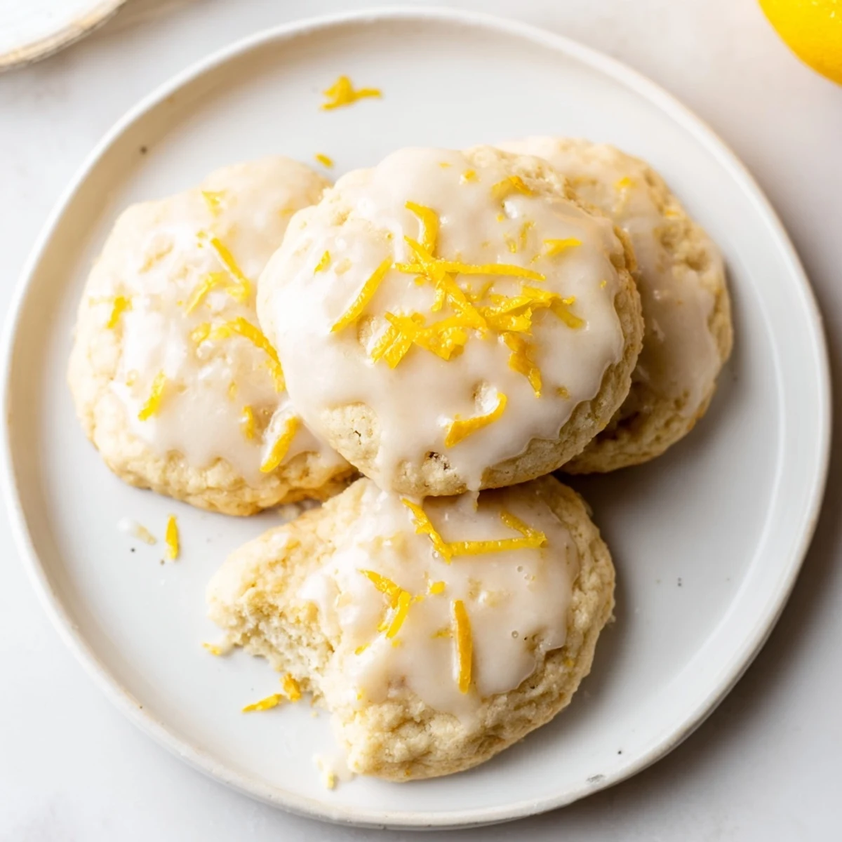 Fresh-baked Lemon Cookies With Lemon Glaze cooling on rack, sweet-tart bite