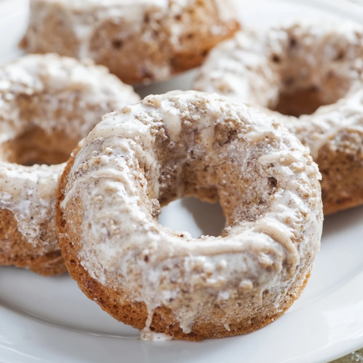 Soft, moist banana bread donuts bursting with ripe banana flavor and finished with a sweet vanilla glaze.