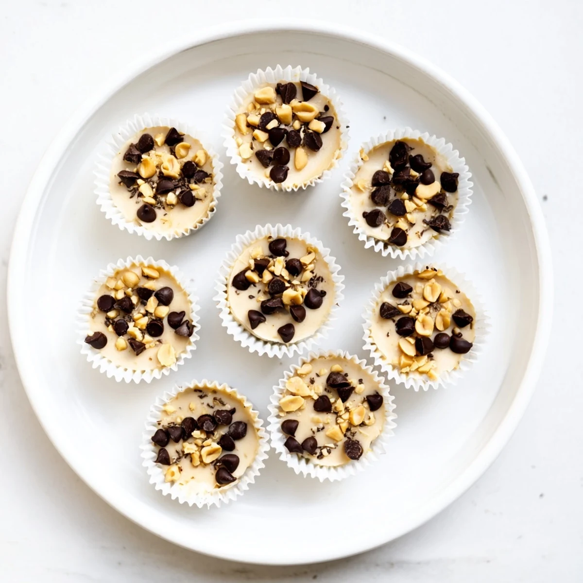 Protein-packed frozen Greek yogurt bites with swirls of peanut butter and crushed peanuts