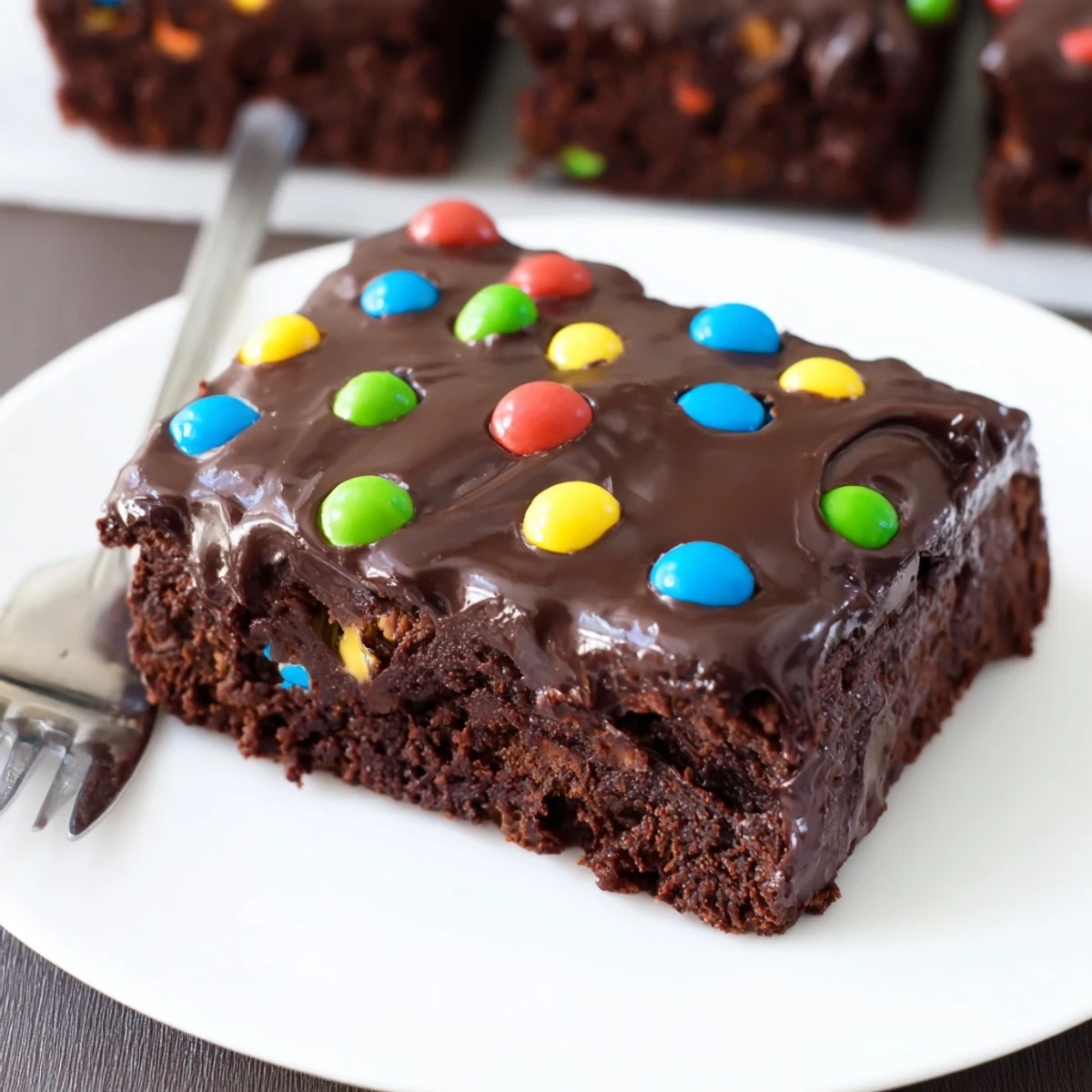 Gourmet Cosmic Brownies Bars with glossy ganache and rainbow candy sprinkles.