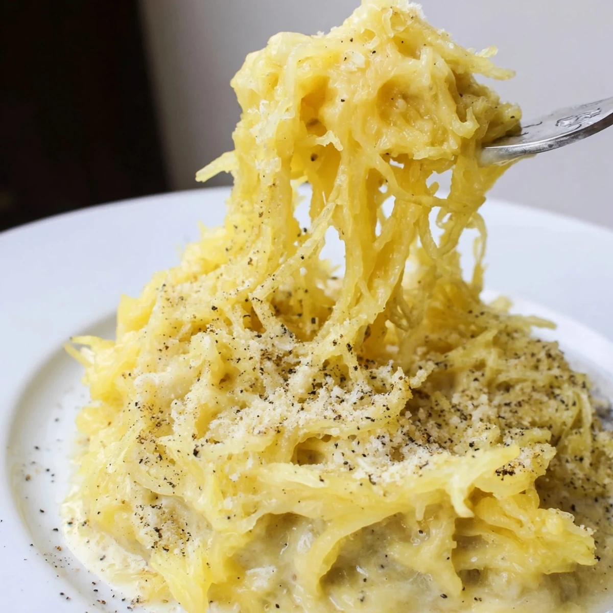 Light Spaghetti Squash Mac Cheese with melted cheddar, sprinkle of parsley.