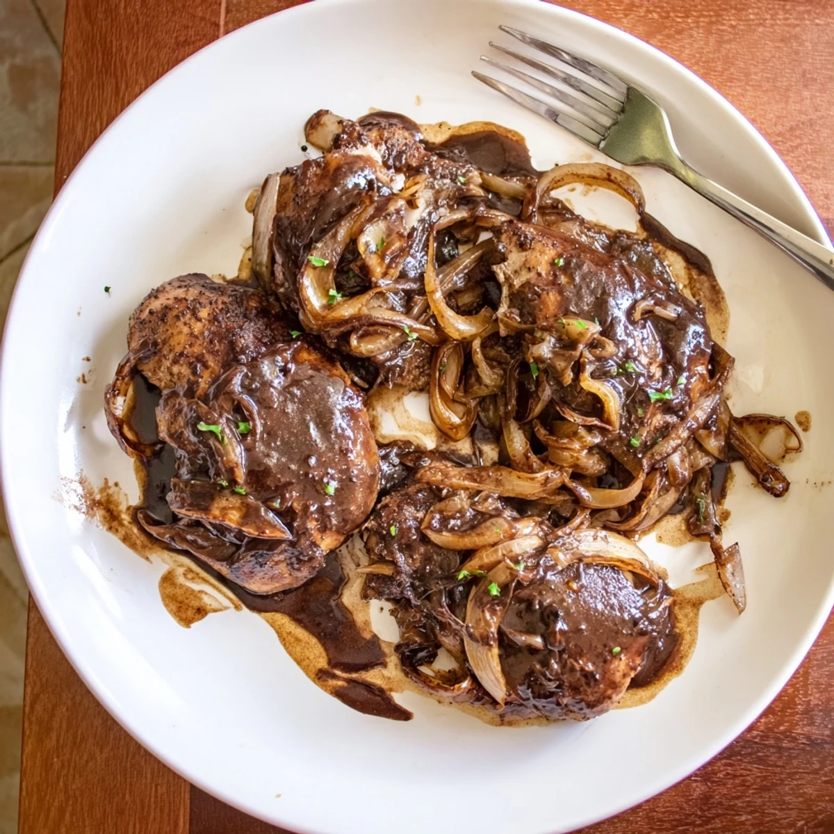 Tender Slow Cooker Balsamic Chicken draped in sweet-savory glaze, garnished with fresh parsley