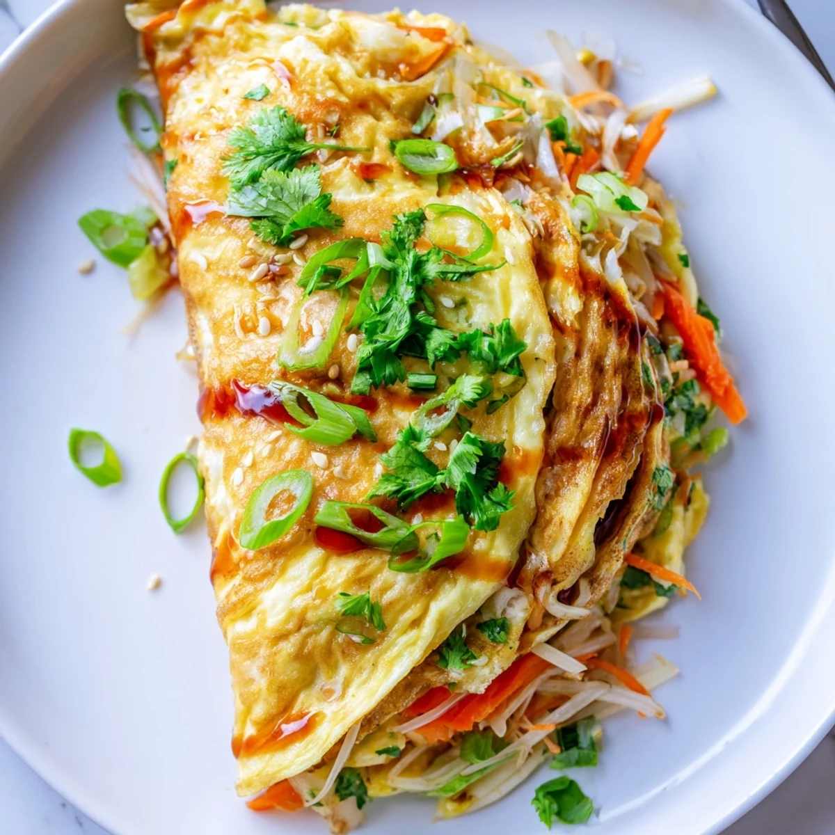 Savory Chinese omelette filled with colorful bell peppers, bean sprouts, and shredded carrots