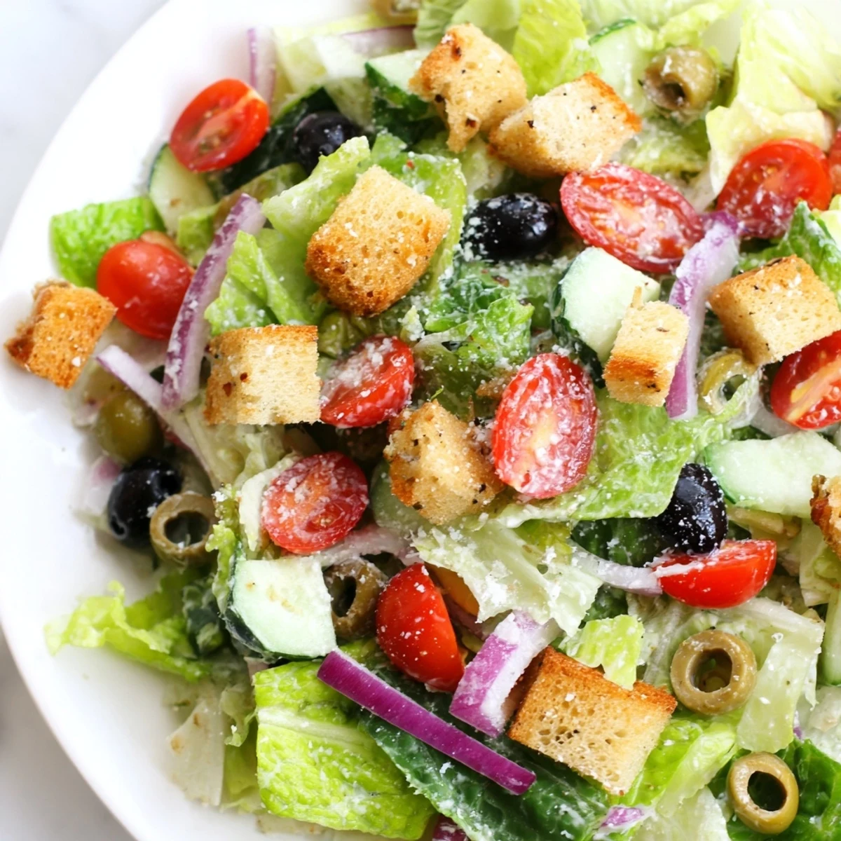 Crisp Olive Garden Salad topped with croutons, Parmesan, and tangy Italian dressing