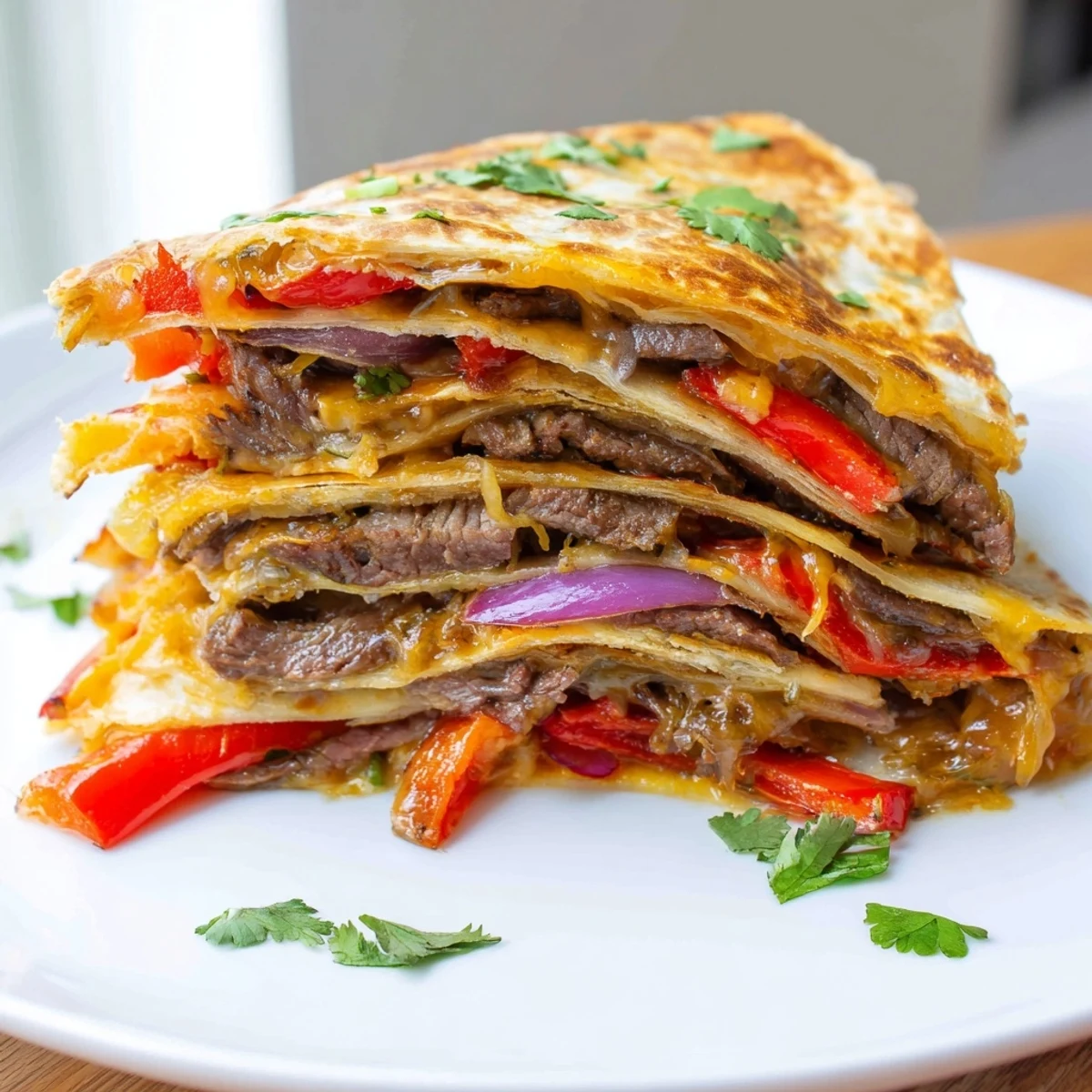 Golden steak quesadillas with melted cheese and sautéed peppers on a rustic plate
